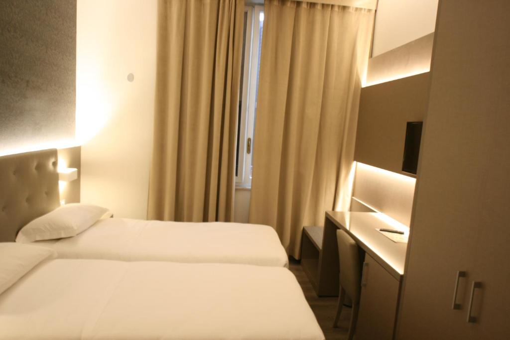 Postel nebo postele na pokoji v ubytování Hotel Principe
