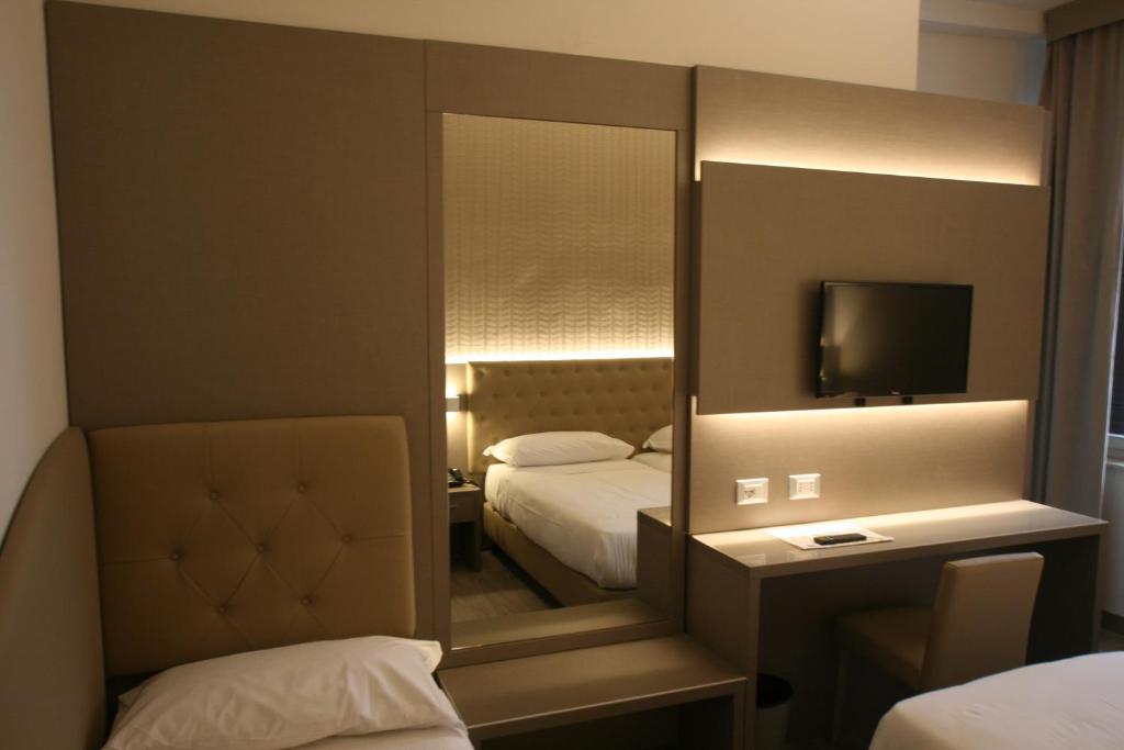 Postel nebo postele na pokoji v ubytování Hotel Principe