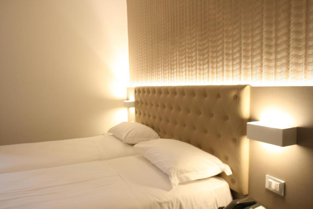 Postel nebo postele na pokoji v ubytování Hotel Principe