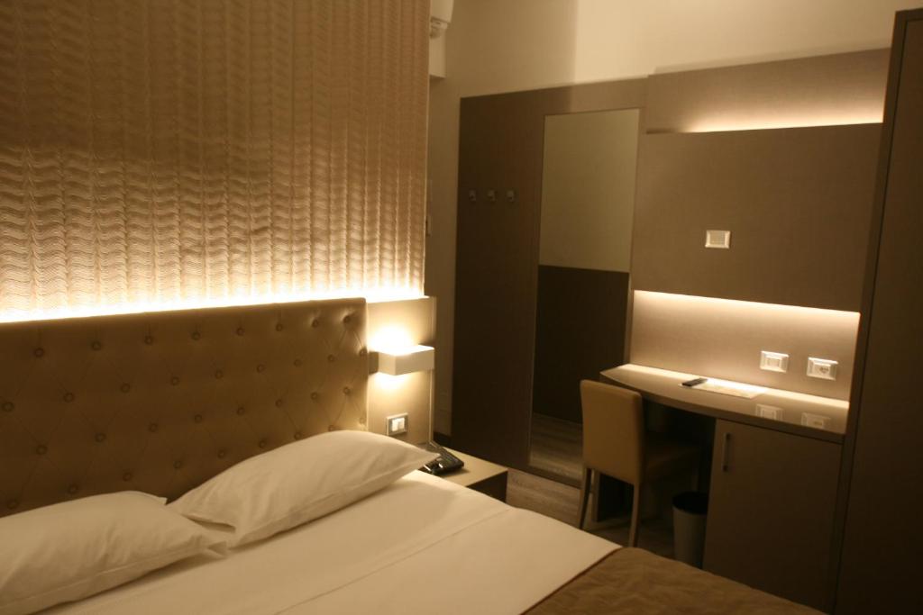 Postel nebo postele na pokoji v ubytování Hotel Principe
