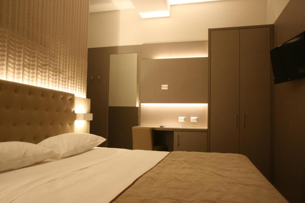 Postel nebo postele na pokoji v ubytování Hotel Principe