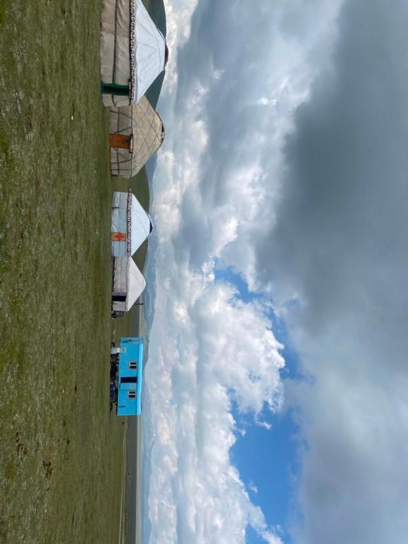 an aerial view of the clouds in the sky at Azamat Yurt Camp in Song-Kul