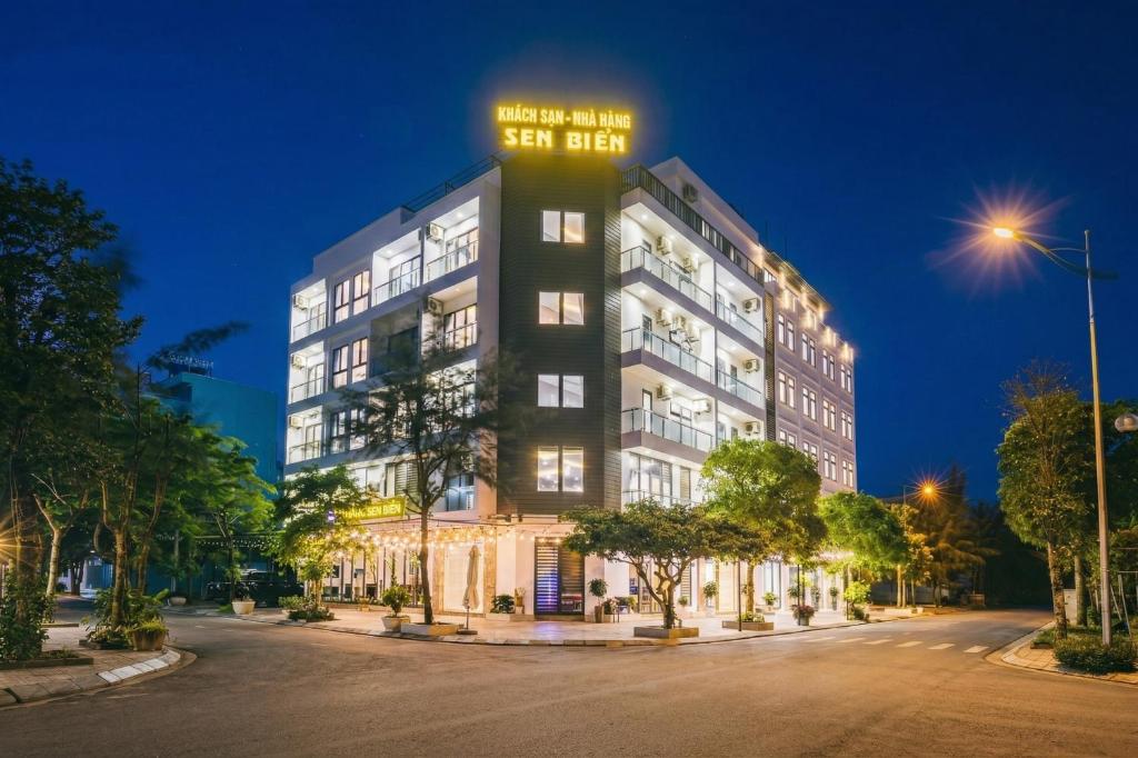 a building with a sign on the top of it at SEN BIỂN HOTEL - FLC Sầm Sơn in Sầm Sơn