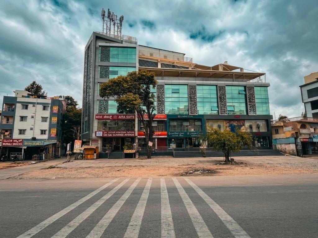 a large building on the side of a street at Aira Suites in Bangalore