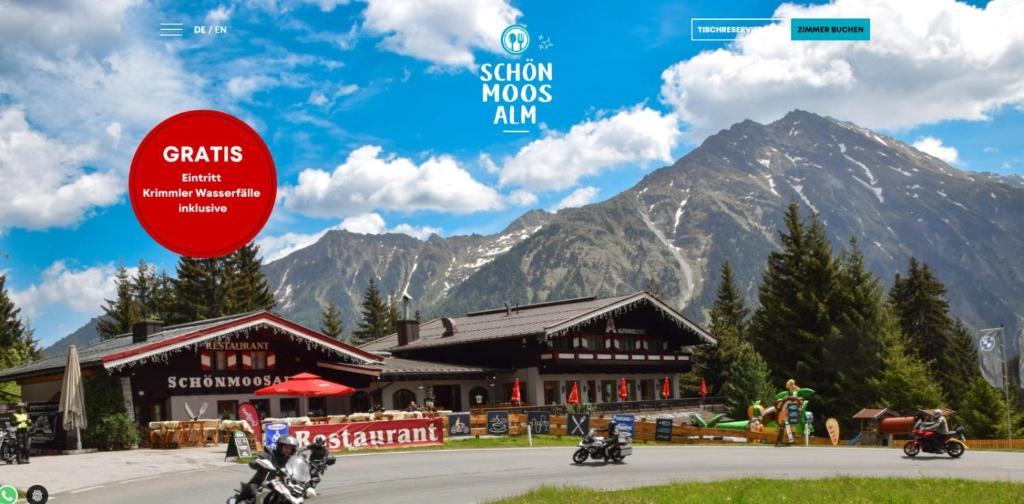a picture of people riding motorcycles in front of a building at Schönmoosalm in Krimml