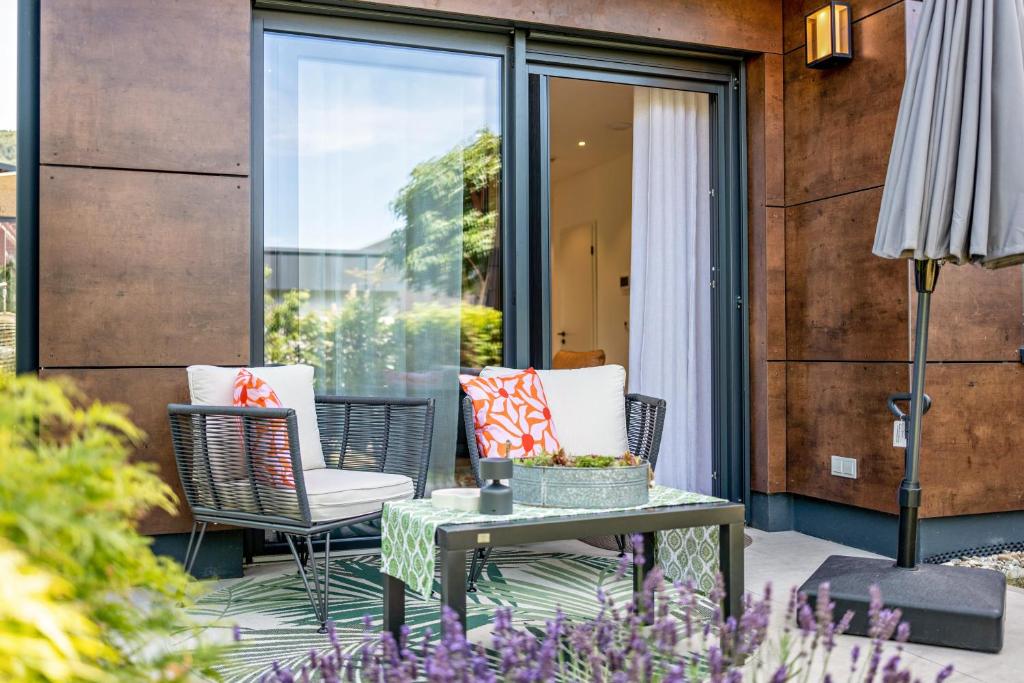 a patio with two chairs and a table at Apartment Nest 20 in Ettenheim