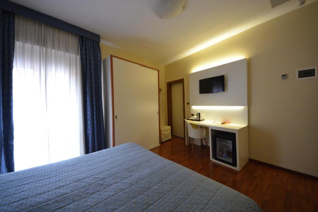 Postel nebo postele na pokoji v ubytování Hotel University