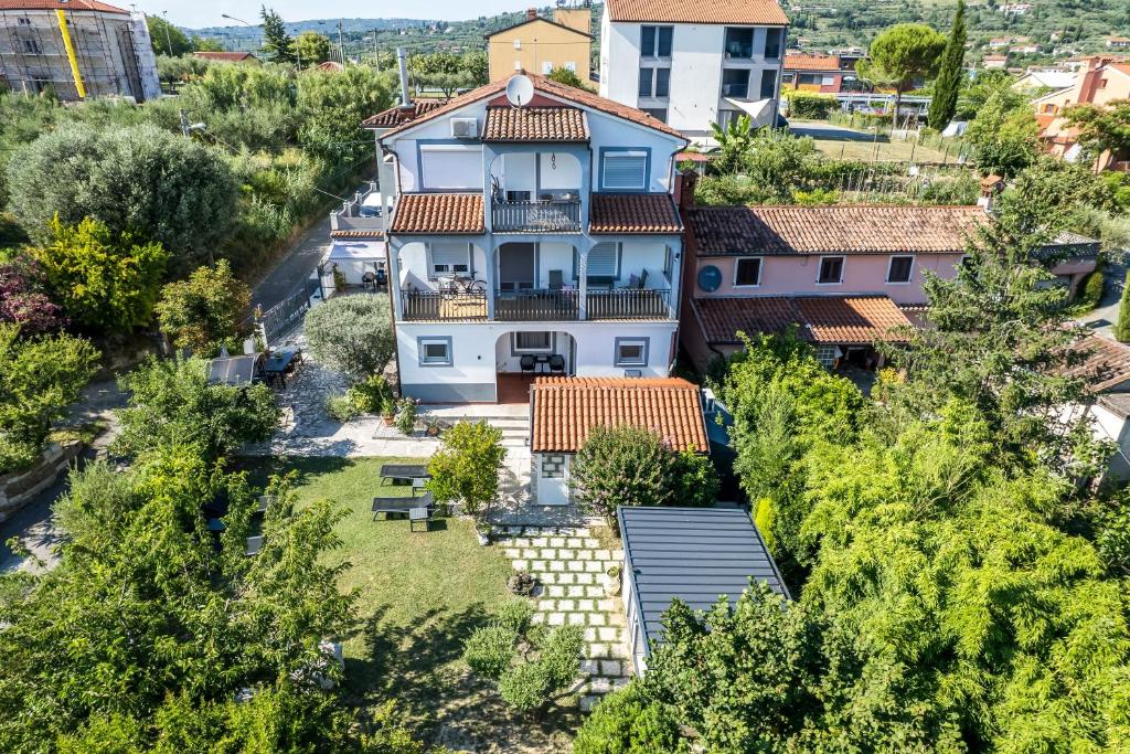 an aerial view of a house with a yard at Villa Bazilika in Sečovlje