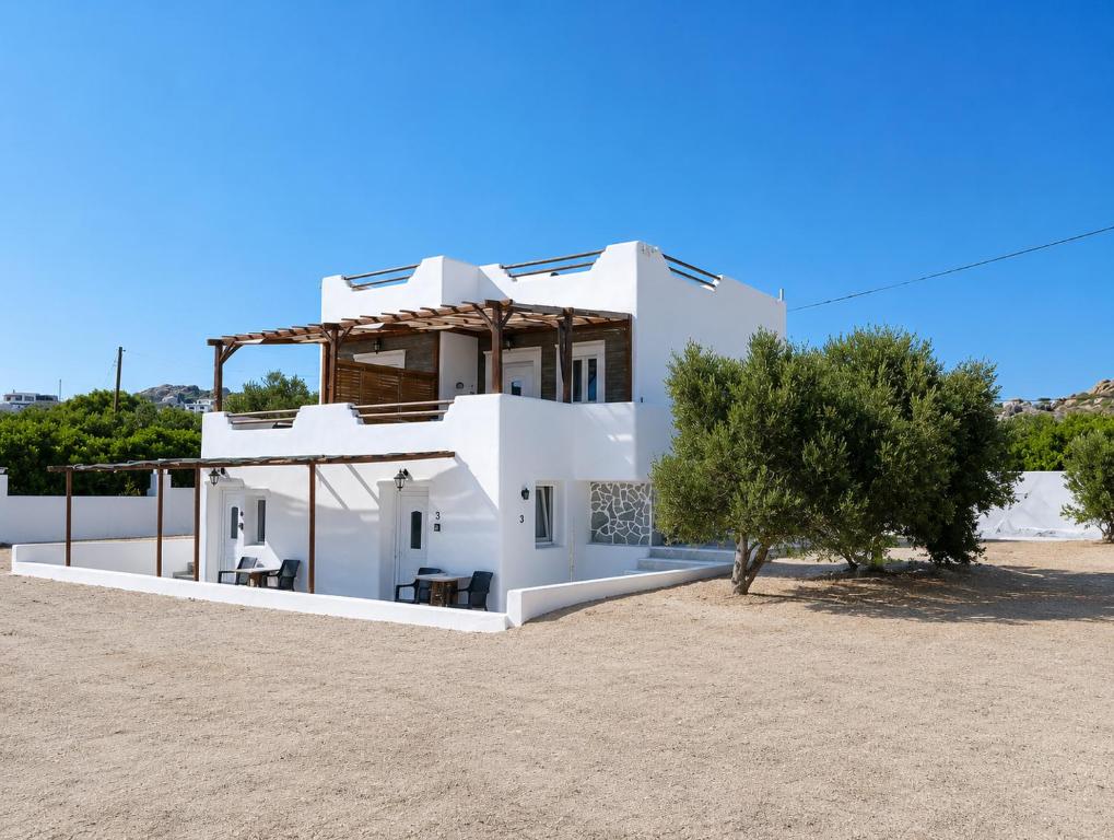 a white house with a tree in front of it at Countryside Retreat 3 in Agios Arsenios