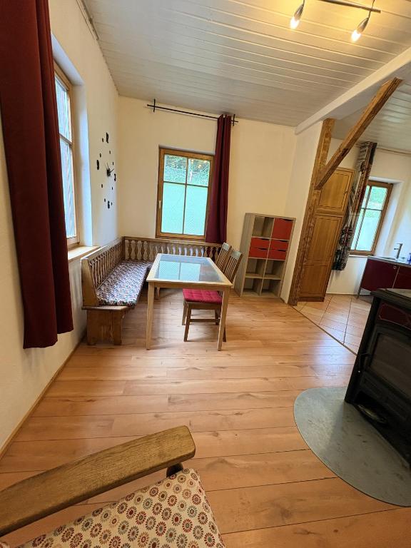a living room with a table and a couch at Naturblick in Neresheim