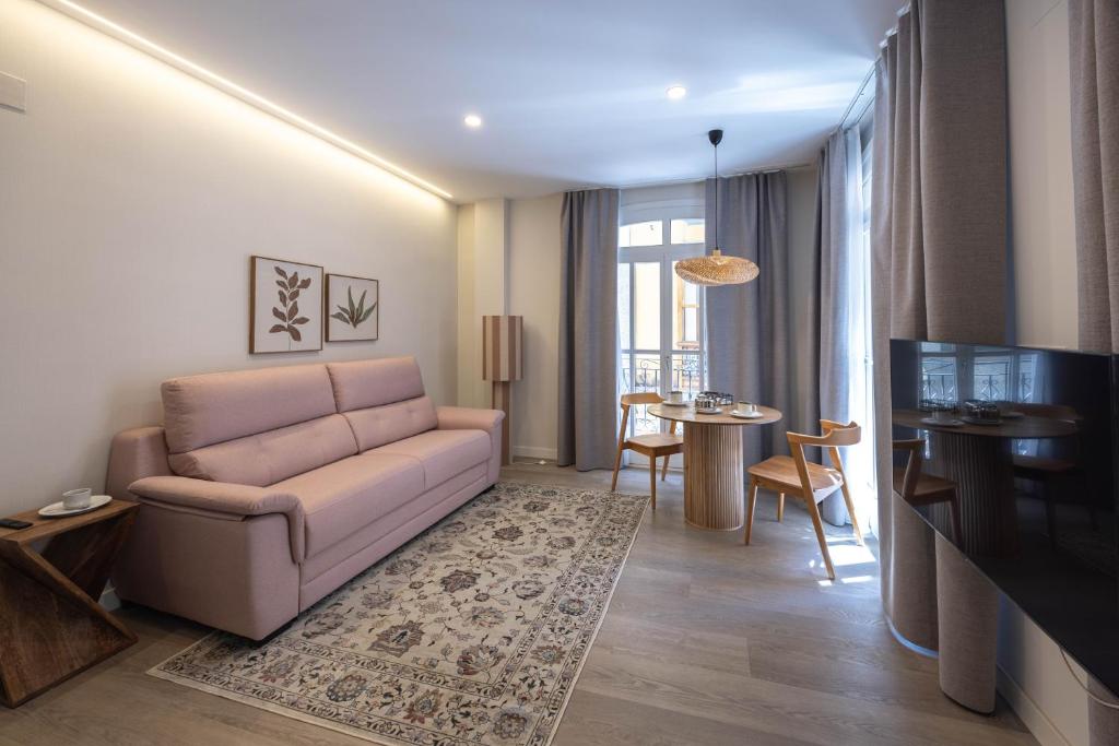 a living room with a couch and a table at Apartamento Nova by Cartagena Spain in Cartagena