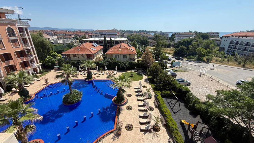 an overhead view of a swimming pool in a resort at Bratanov Cascadas Ravda in Ravda