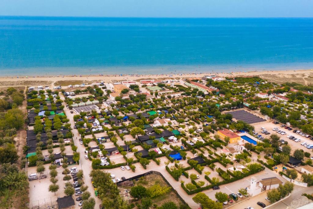 an aerial view of a parking lot next to the beach at Kampaoh Oliva in Oliva