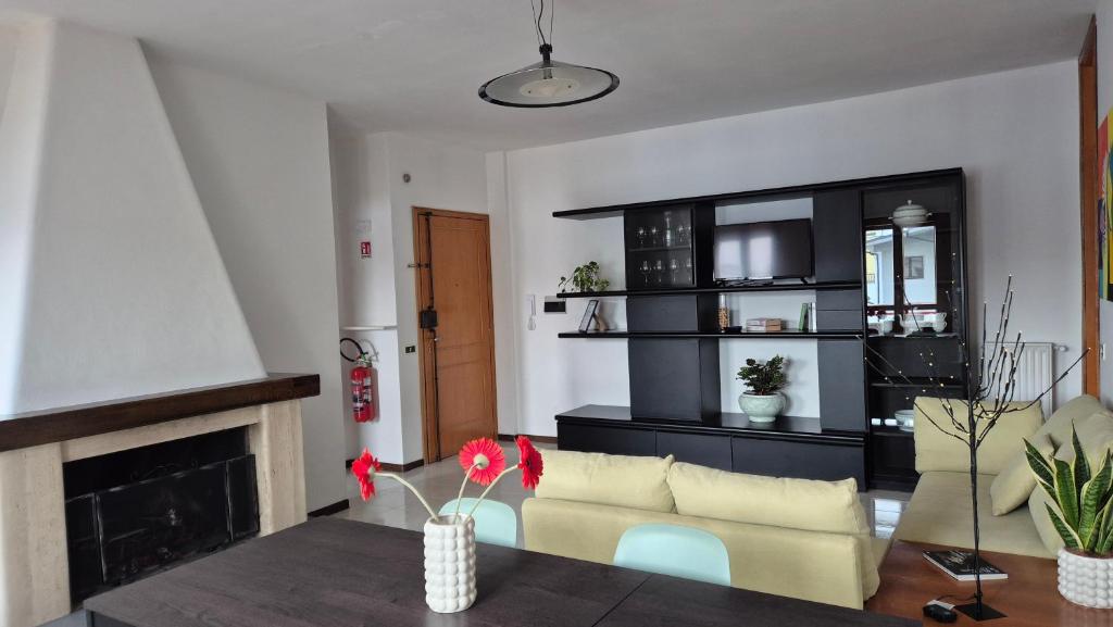 a living room with a couch and a fireplace at Attico 14 in Castel di Sangro
