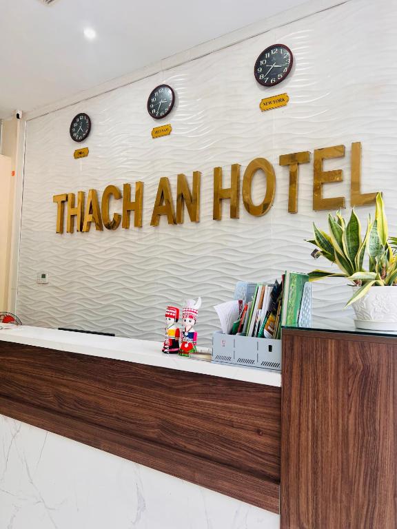 a sign that reads an above a counter at Thach An Hotel in Ðông Khê