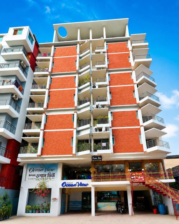 a large apartment building with balconies on it at Hotel Impulse Ocean View in Cox's Bazar