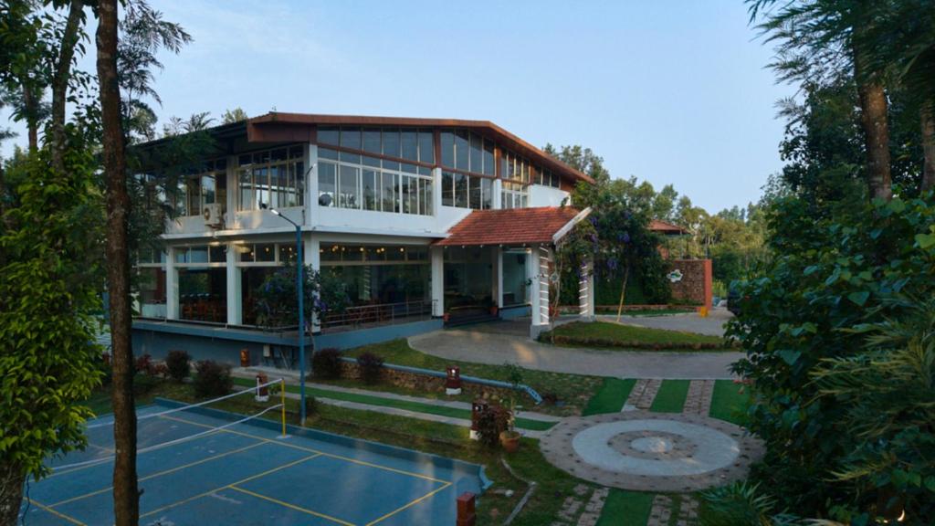 an aerial view of a house with a courtyard at Coffee Grove Resort in Chikmagalūr