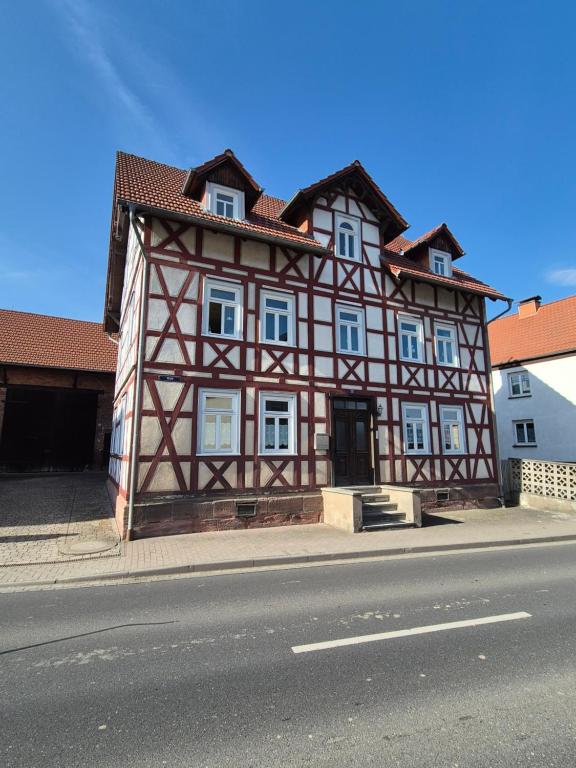 a building on the side of a street at Ferienwohnung am Oechsenberg in Unterbreizbach