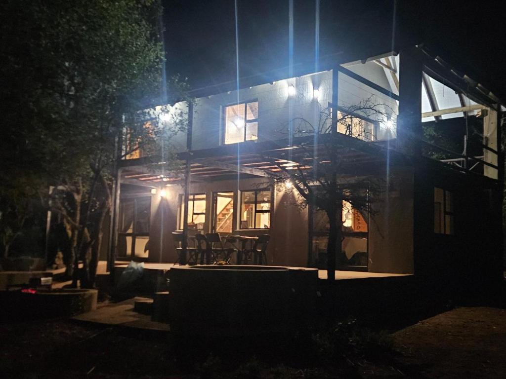 a house at night with the lights on at Khoneni in Marloth Park