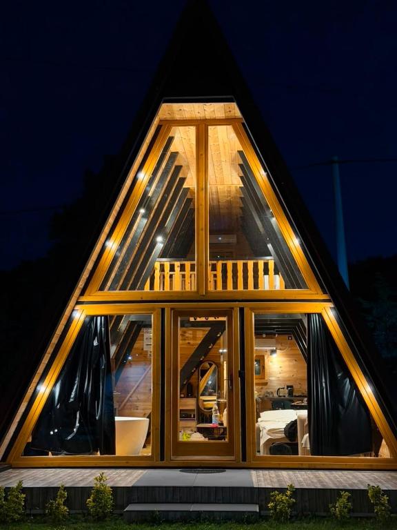 a house with a large window in the middle at Veis House in Vrba
