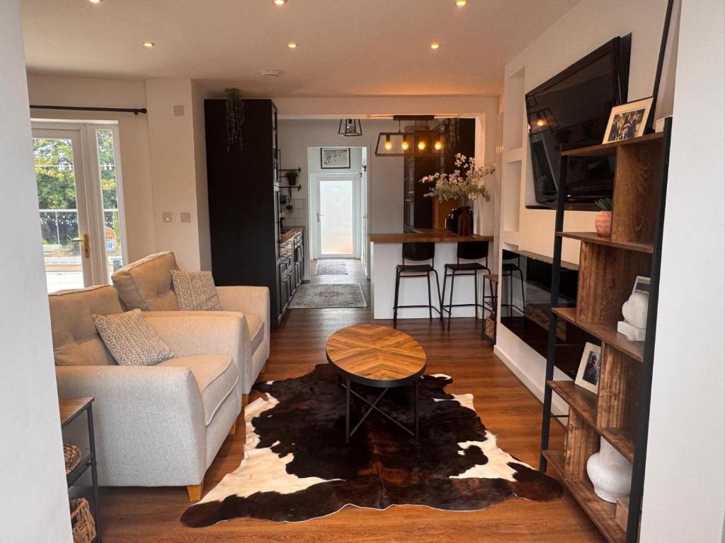 a living room with a couch and a table at Hesketh Hideaway 1 in Marshside