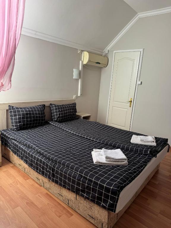 Postel nebo postele na pokoji v ubytování Centrum Hotel