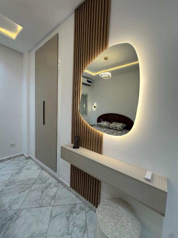 a bathroom with a mirror on the wall at Cozy Corner in Sousse