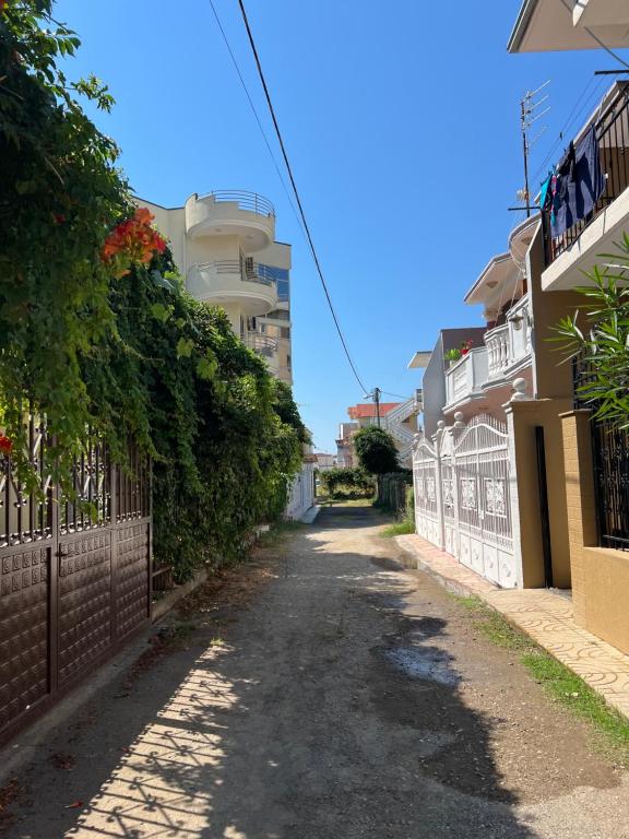 an empty street in a city with buildings at Velipoja Hospitality in Velipojë
