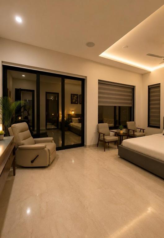 a bedroom with a bed and a couch and chairs at Kanchan Jayanti Villa in Khandāla