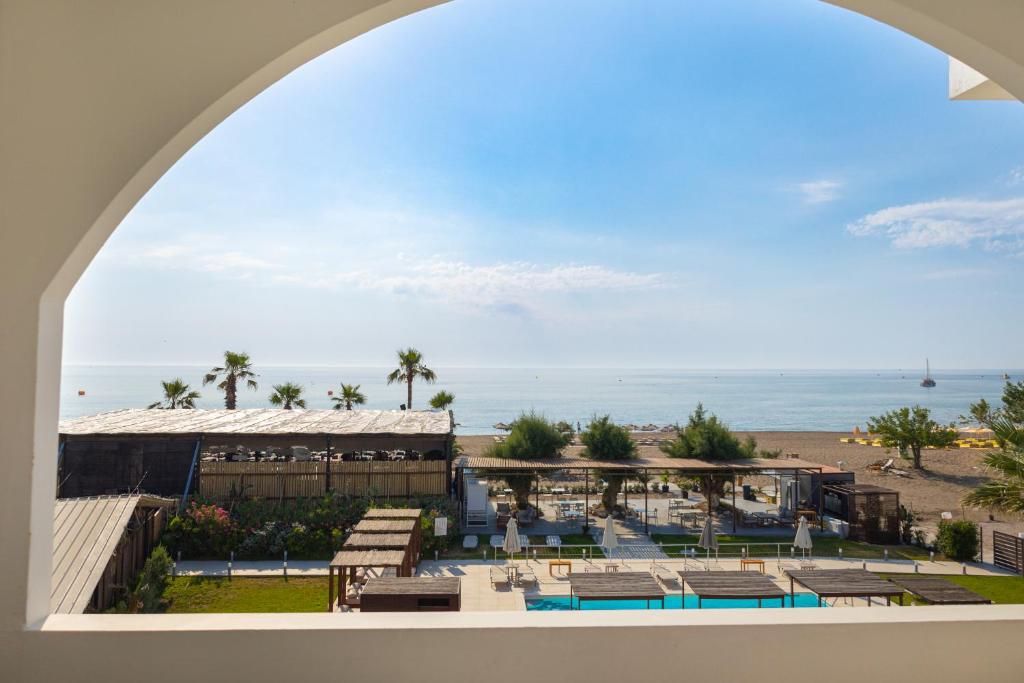 a view of a resort with the ocean in the background at Beach Break Rhodes in Faliraki
