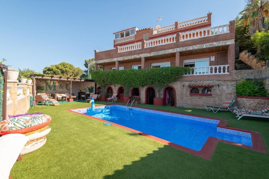 a house with a swimming pool in the yard at House close to the beach! Pool, ocean view! in Santa Susanna