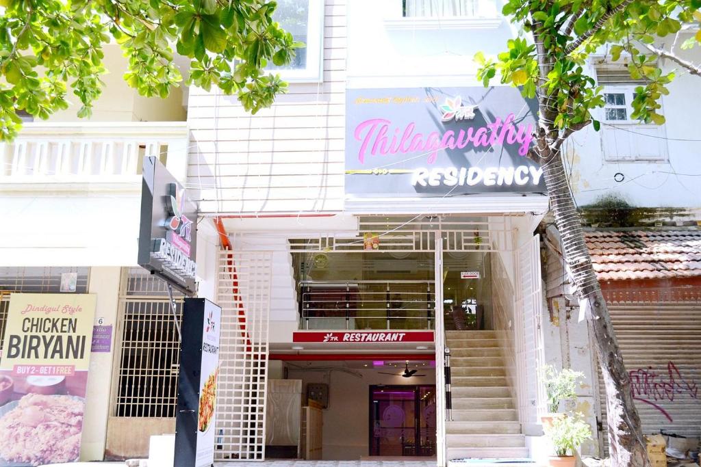 a building with a sign on the front of it at TR Residency in Pondicherry
