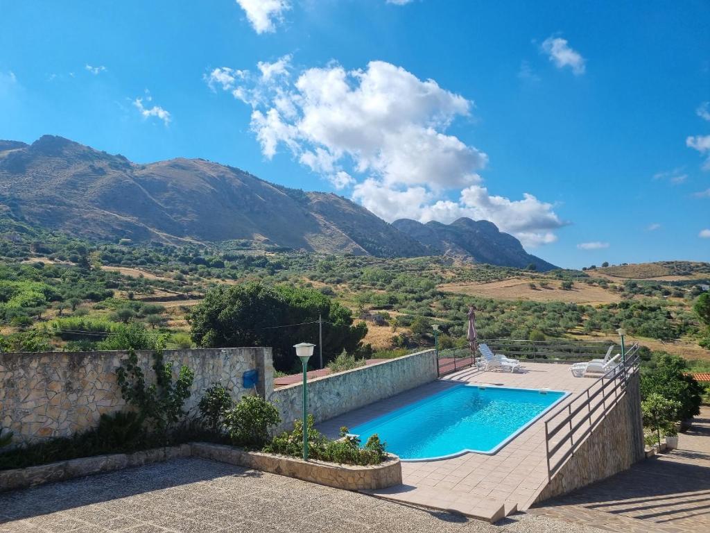 a villa with a swimming pool and mountains in the background at Beautiful Villa in Caccamo + Pool in Caccamo