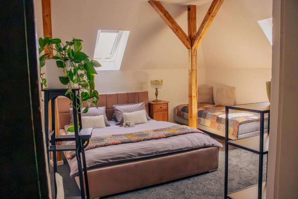 a bedroom with a bunk bed and two beds at Apartmány Saxana in Smržovka