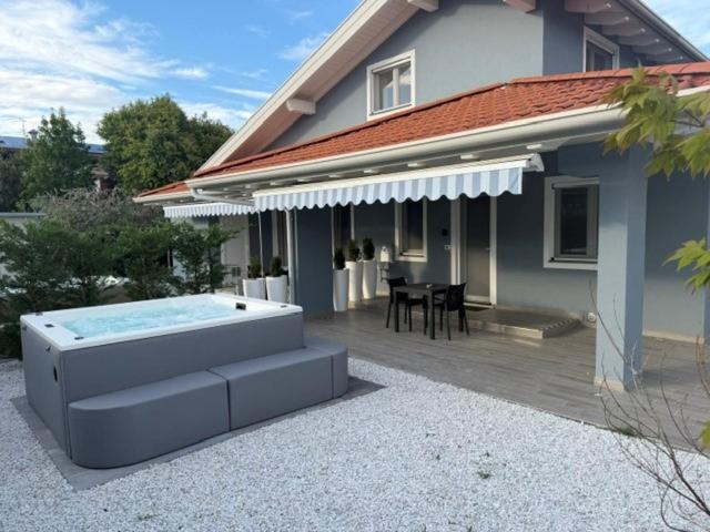 a house with a swimming pool in front of a house at Rebecca's House in Staranzano