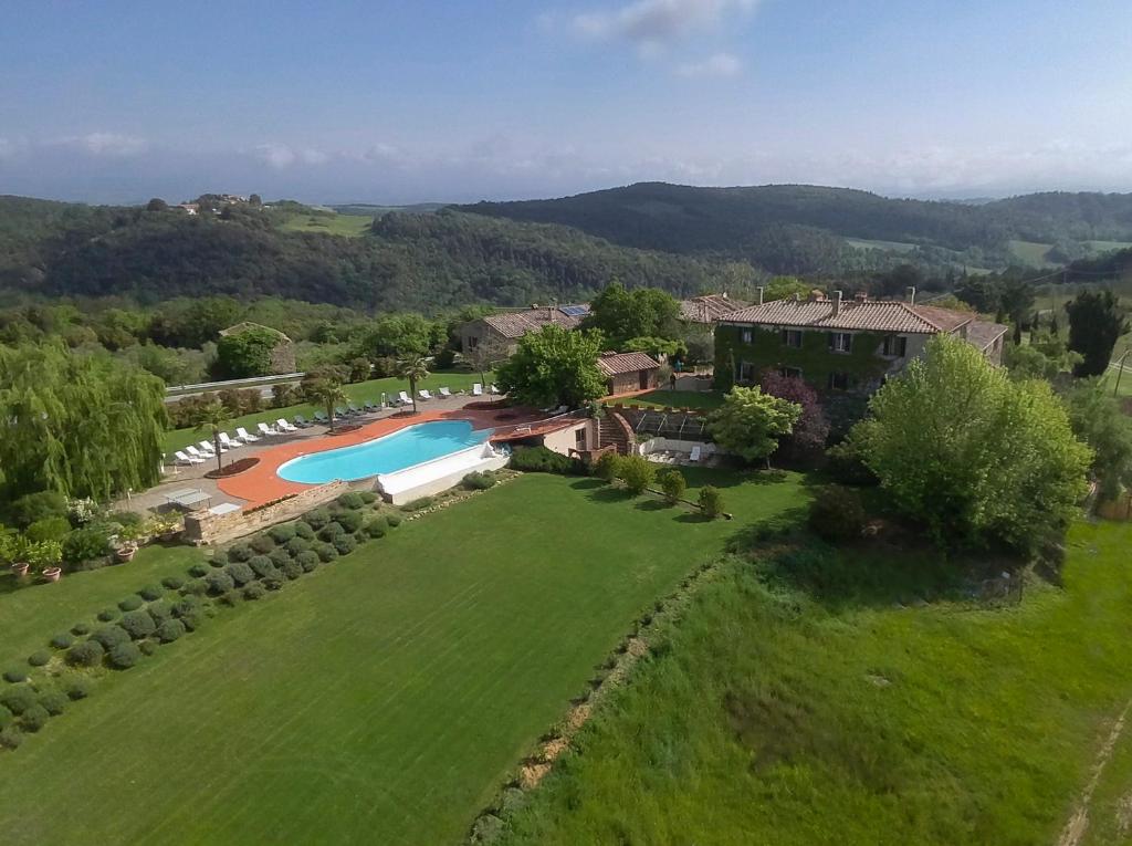 an aerial view of a house with a large yard at Quaint house in Murlo with shared pool in Murlo