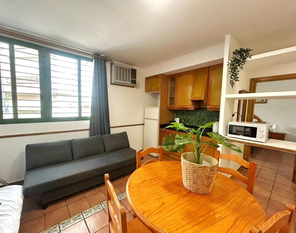 a living room with a couch and a table at Cisne del Mar ComoTuCasa in Castellón de la Plana