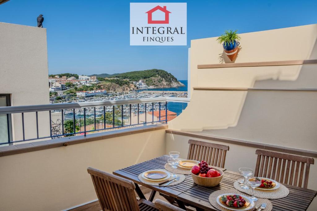 a balcony with a table with a view of the ocean at Casa Terral in Palamós