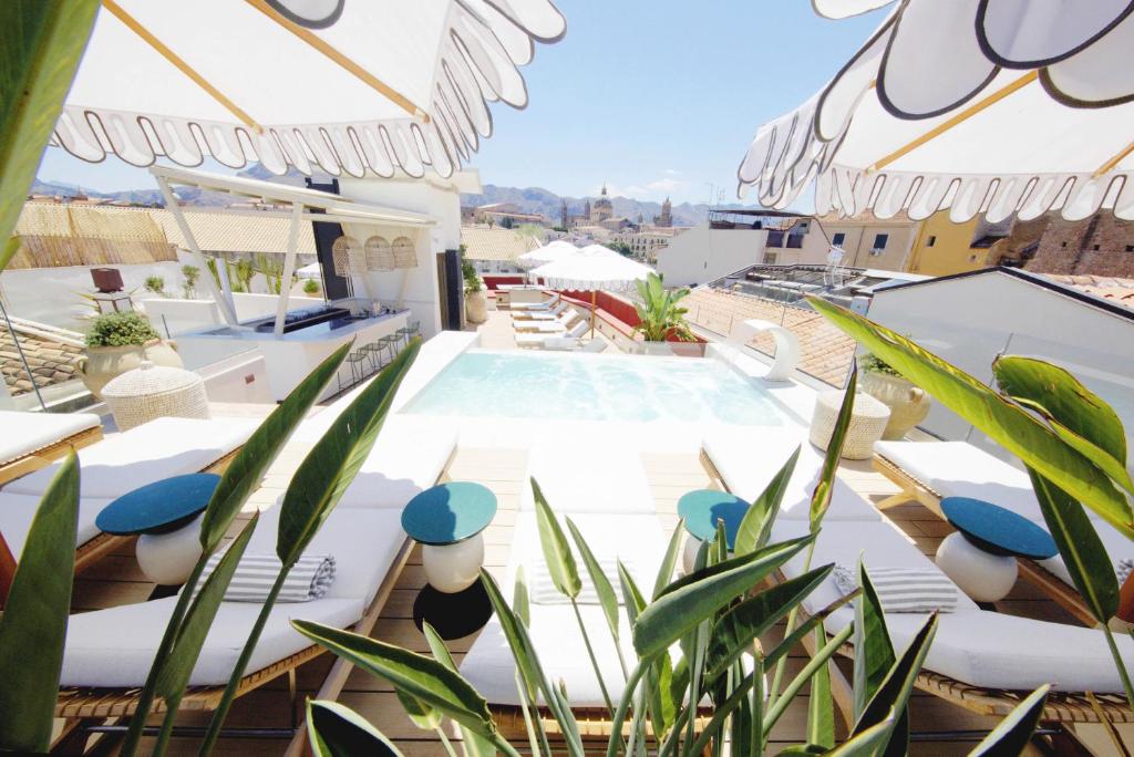 a view from the roof of a house with a swimming pool at Casa Nostra Luxury Suites & Spa in Palermo