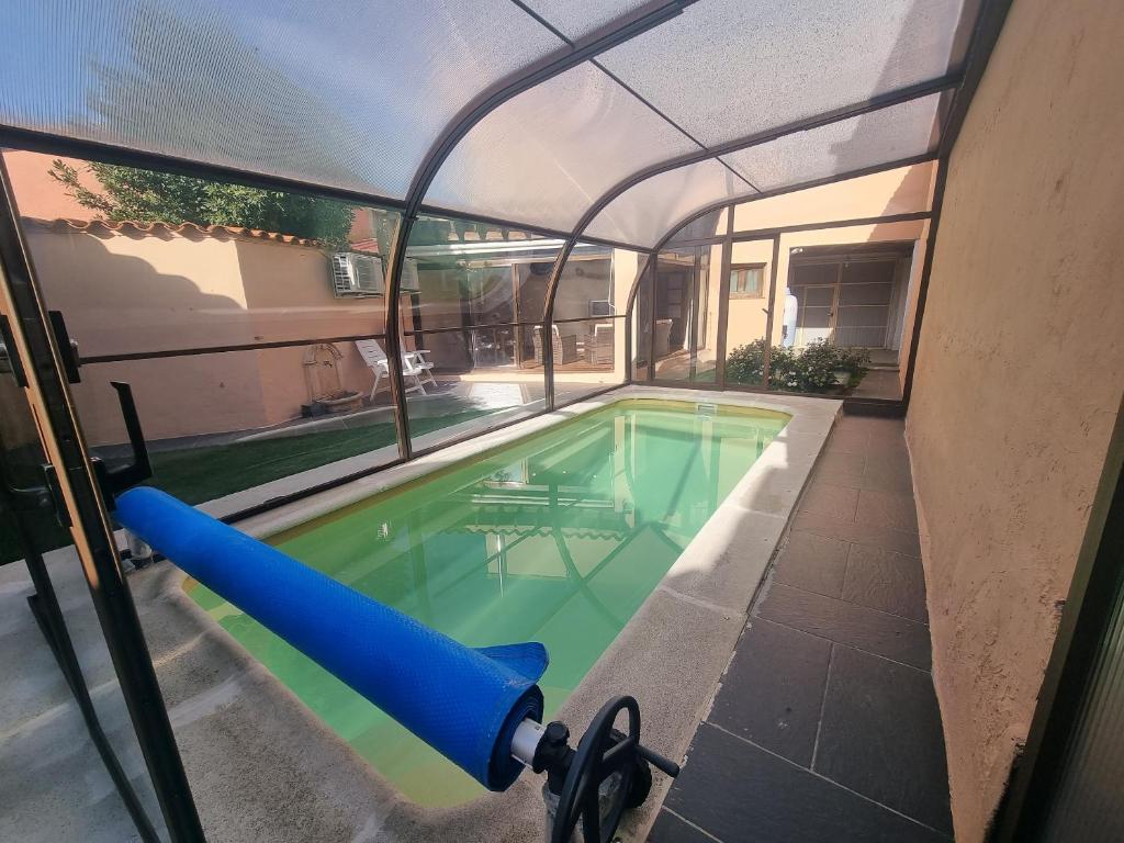 an indoor swimming pool with an arch over it at Charming villa in Pajares de la Lampreana with private pool in Pajares de la Lampreana