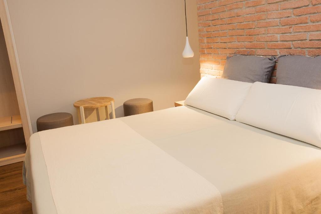 Postel nebo postele na pokoji v ubytování Hostal Fernando