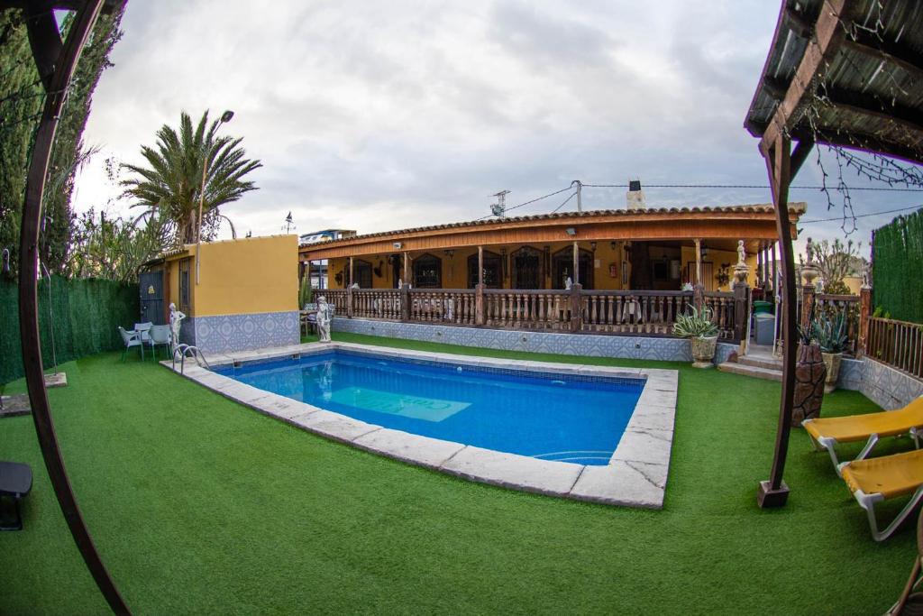 a house with a swimming pool in a yard at Elegant Villa in Archena + Private Pool in Archena