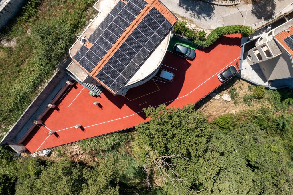 an overhead view of a house with a solar roof at Alessandra Apartments & free private parking in Sveti Stefan