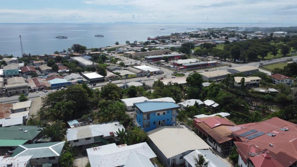 an aerial view of a city with the water at Panatina Sunset Residence in Honiara