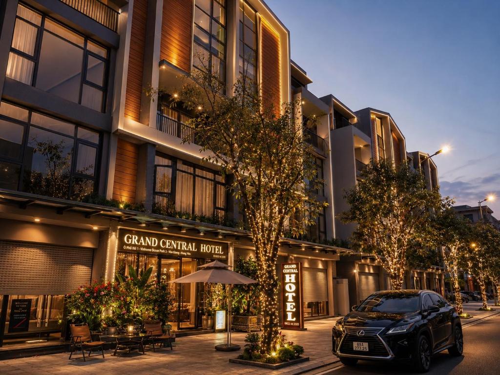 a car parked in front of a building at Grand Central Hotel- Vinhomes Ocean Park 3 in Ðình Loan