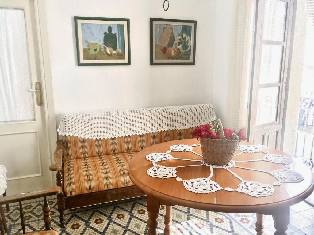 a living room with a couch and a table at Charming Apartment in Albuñol, 90 m², Near Amenities in Albuñol