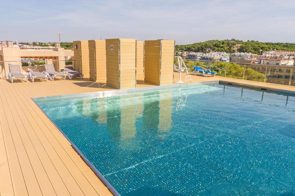 a swimming pool on the roof of a building at Modern Apartment in Salou - 50 m² + Pool in Salou