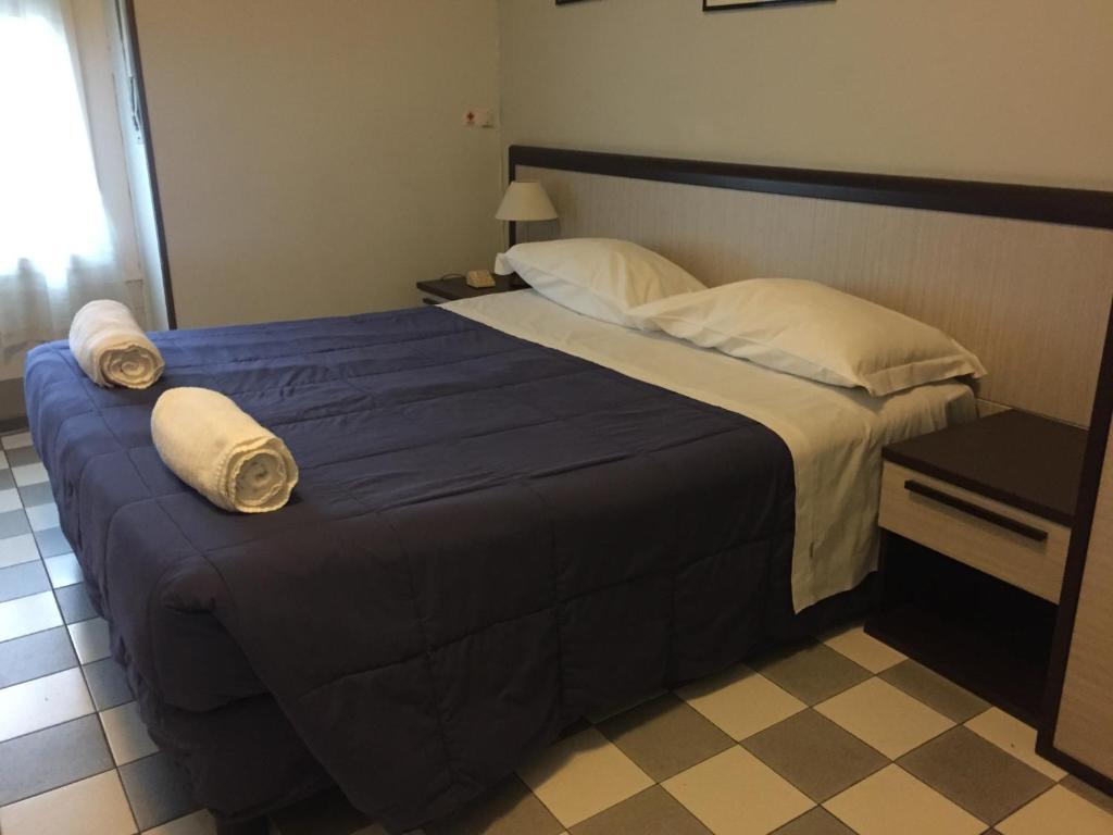 Postel nebo postele na pokoji v ubytování Hotel Eva