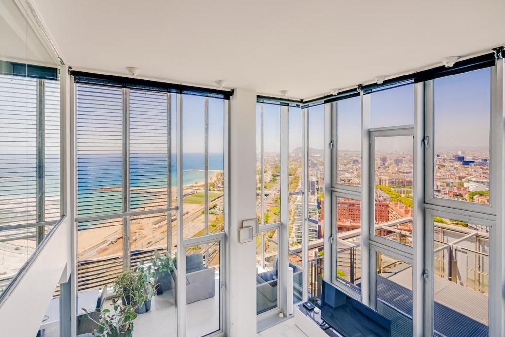 an apartment with views of the ocean from windows at Penthouse With The Best Views! in Barcelona
