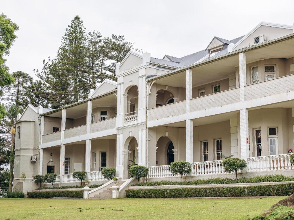 an exterior view of a large white building at Kearsney Manor in KwaDukuza